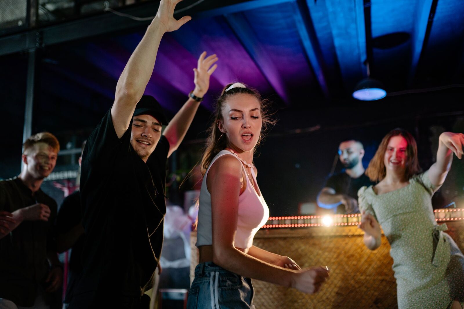 People dancing to music at a club night